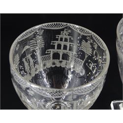Two 19th century glass rummers, the first example with bowl engraved with floral spray and inscribed 'Success to Rochdale Canal', upon faceted stem and square base, H14cm, the second example with bowl engraved with two figures and a pagoda and inscribed 'Lawrence Taylor Esqr Capn of the Rosendale Rangers', upon a spreading stem and square base, H13cm