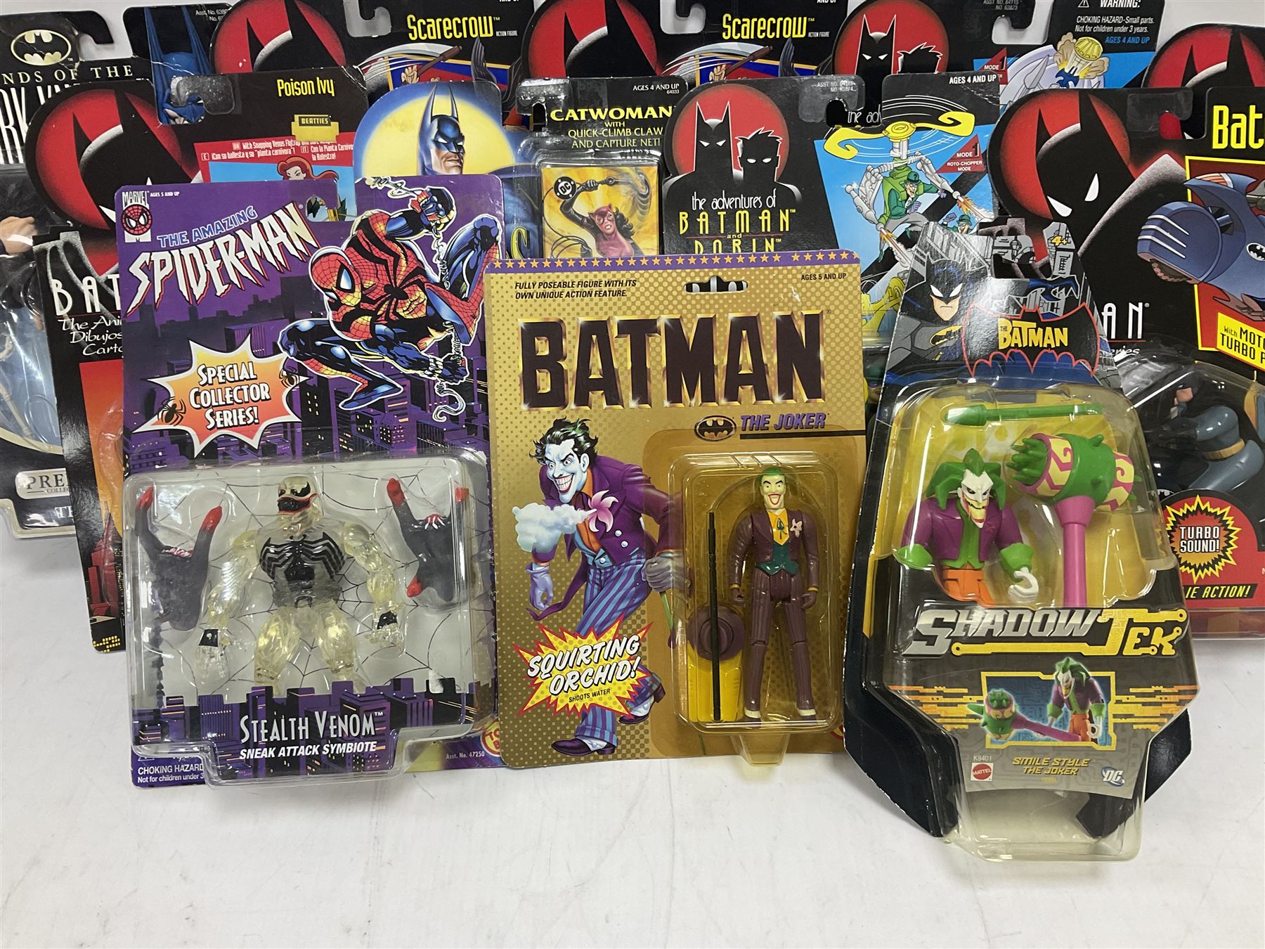 Twenty-four carded action figures of Batman (11) and other Super Heroes including Spiderman, DC Universe, Xyber 9 etc; all in unopened blister packs (24)