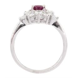 18ct white gold ruby and diamond cluster ring, the oval cut ruby of 0.86 carat, with marquise cut and round brilliant cut diamond surround, London 2004, total diamond weight 0.65 carat 