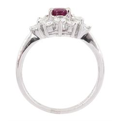 18ct white gold ruby and diamond cluster ring, the oval cut ruby of 0.86 carat, with marquise cut and round brilliant cut diamond surround, London 2004, total diamond weight 0.65 carat 