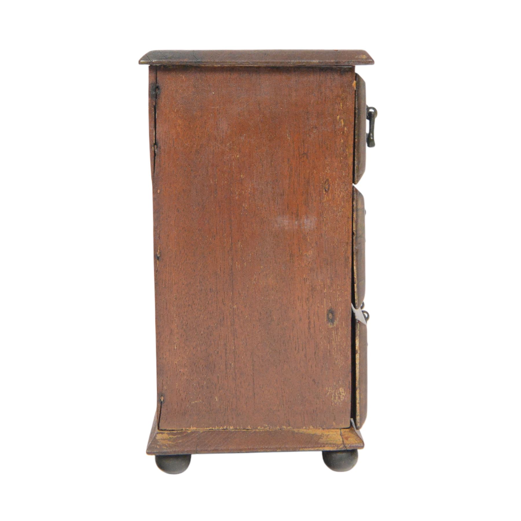 Table top chest of drawers, of rectangular form, with two short and two long drawers, raised upon bun feet, H22cm