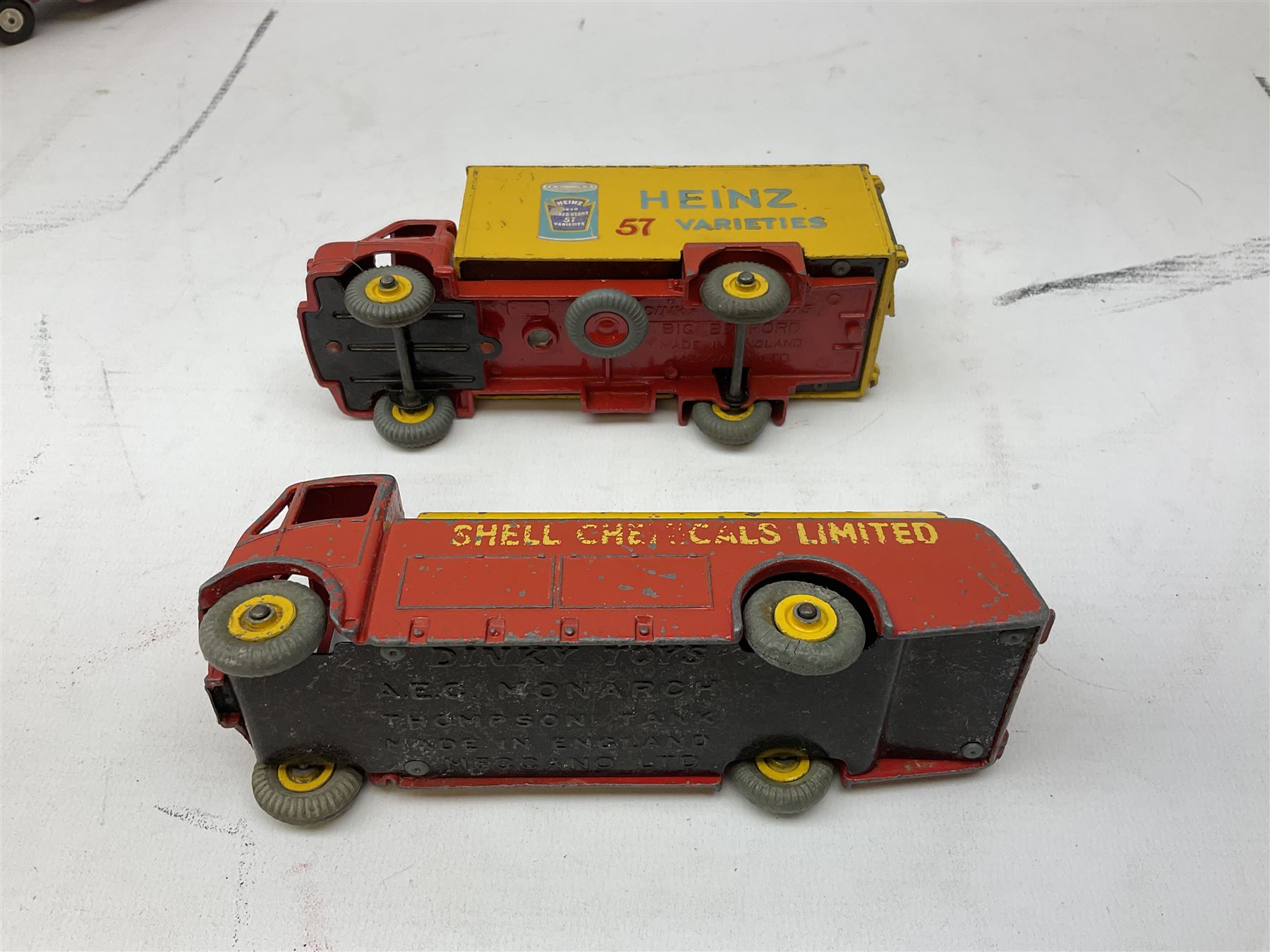 Dinky - five unboxed and playworn die-cast models comprising Supertoys Big Bedford Van 'Heinz' No.923; A.E.C. Monarch Thompson Tank; Maserati Racing Car No.231; H.W.M. Racing Car 23J; and Royal Mail Van; together with a Corgi Mobilgas Tanker (6)