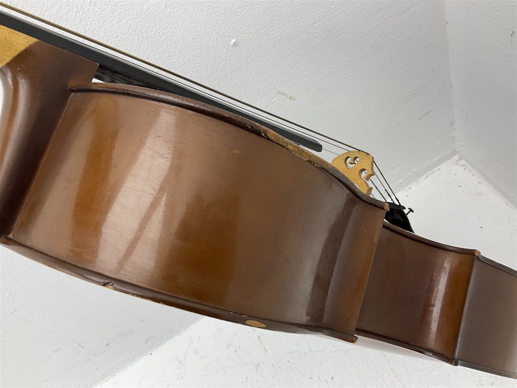 Modern Romanian student's three-quarter size cello with 70cm two-piece maple back and ribs and spruce top, bears label 'Musikinstrumentenfabrik Reghin Romania' L115cm overall