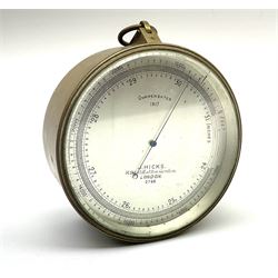 WW1 brass cased compensated barometer with altimeter scale by J. Hicks 8/9/10 Hatton Garden London No.2768, of drum shaped form, the silvered dial dated 1917, with impressed broad arrow mark to back and suspension ring to top D12cm