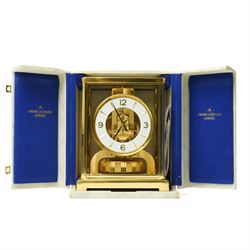 Jaeger- LeCoultre Atmos clock No.291241, with white dial in brass and five glass case and outer carrying case with instruction booklet and original receipt dated 1970 H22cm