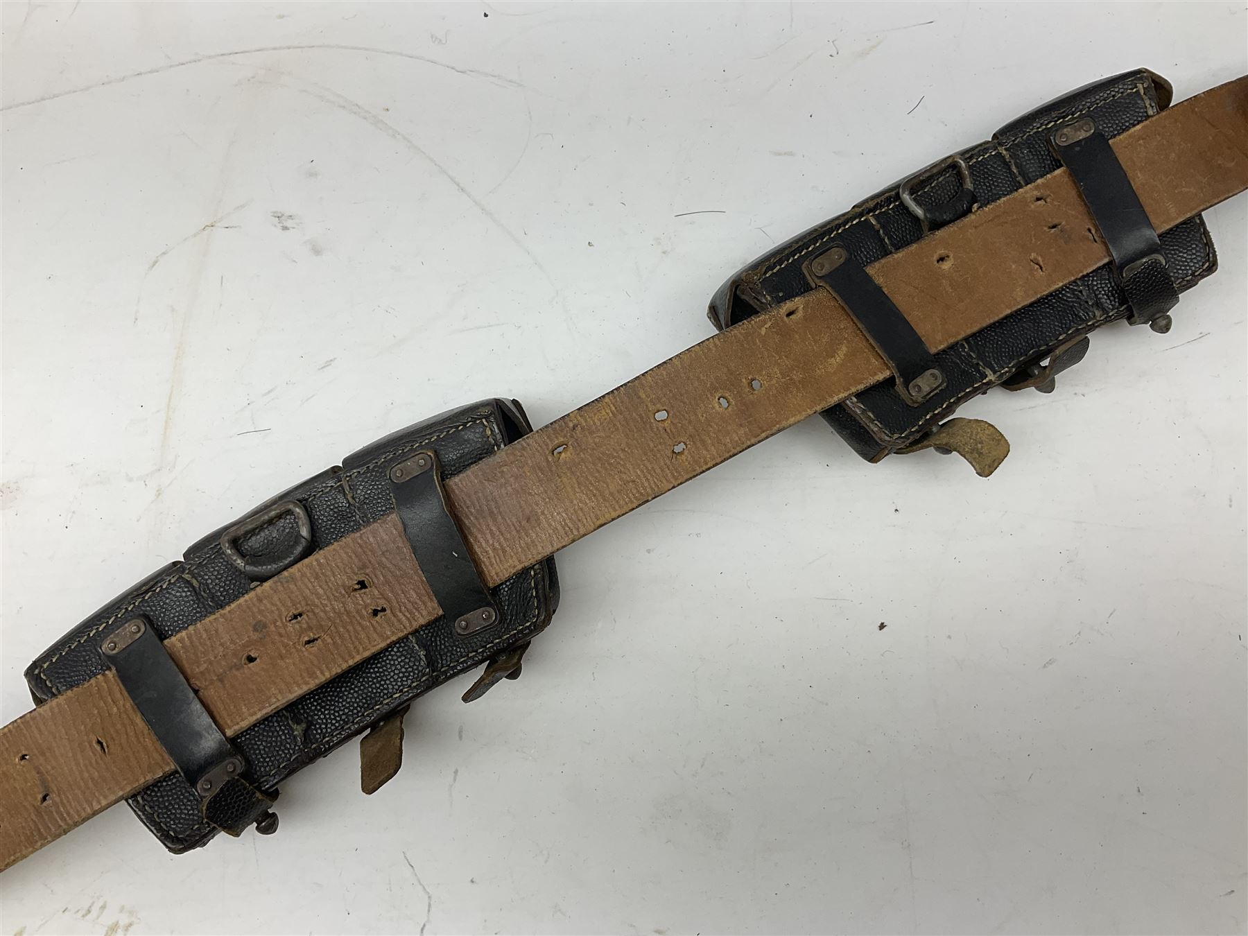 WW2 German 'SS' leather belt with six pouches (one containing unused field bandage) and buckle inscribed 'Meine Ehre Heifst Treue'; belt marked 0/0836 0029