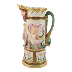 Royal Worcester Neptune pitcher, decorated in relief with mermaids, shells and seaweed above a panelled band of dolphins and shell, dolphin modelled handle and Neptune mask spout, with green mark beneath, H25cm