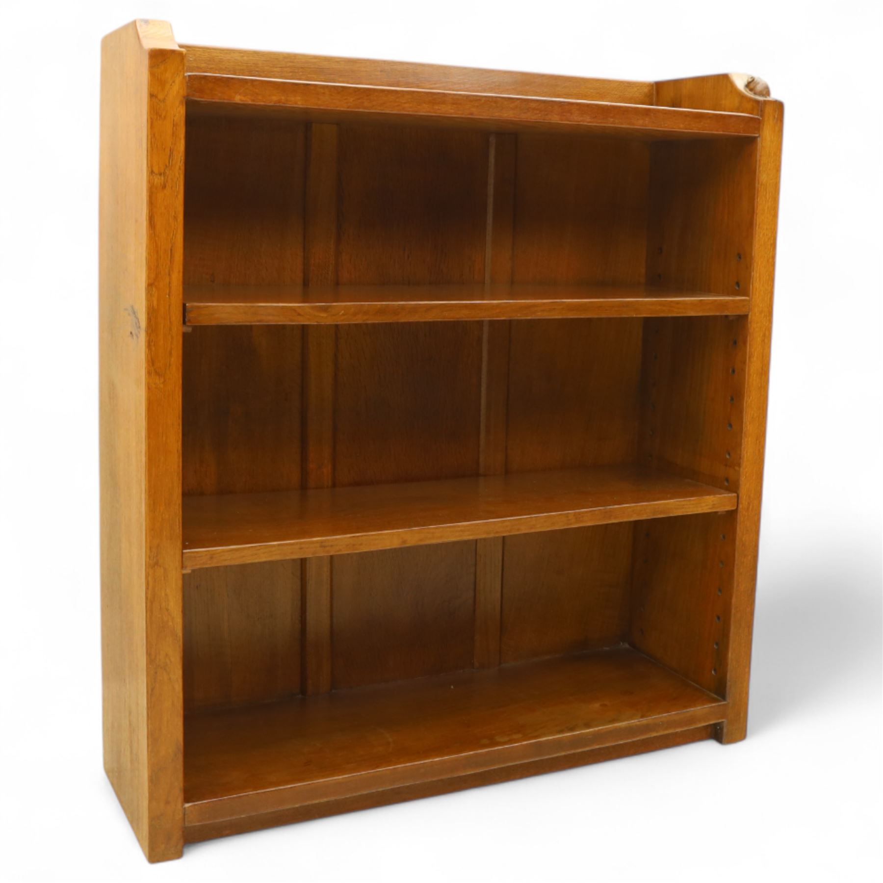 Mouseman - oak open bookcase, galleried top with the signature mouse motif carving, two adjustable shelves, by the workshop of Robert Thompson, Kilburn