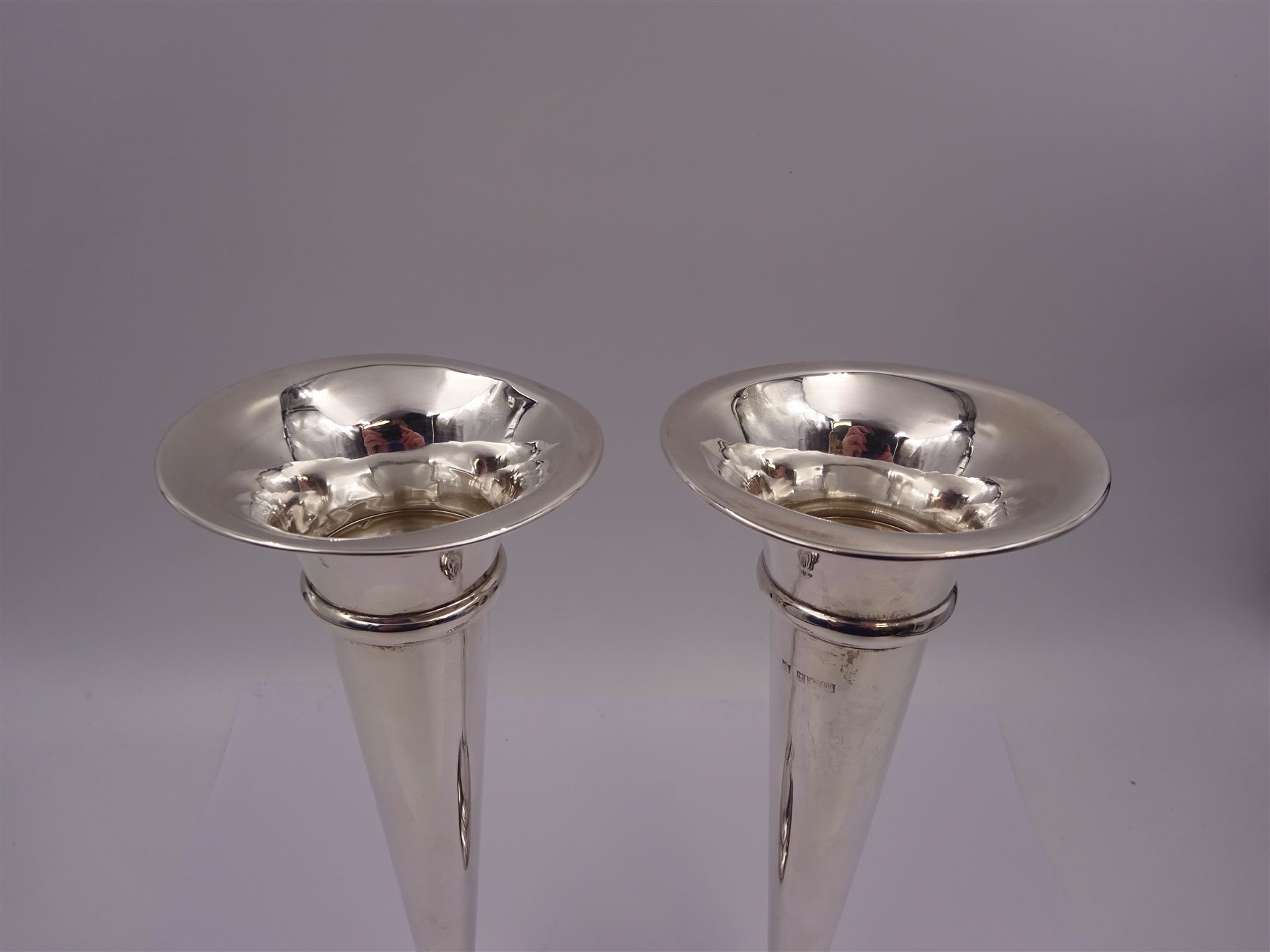 Pair of modern silver trumpet vases, each with fluted rim, upon tapering stem and slightly domed weighted circular foot, hallmarked Charles S Green & Co Ltd, Birmingham 1971, H20cm