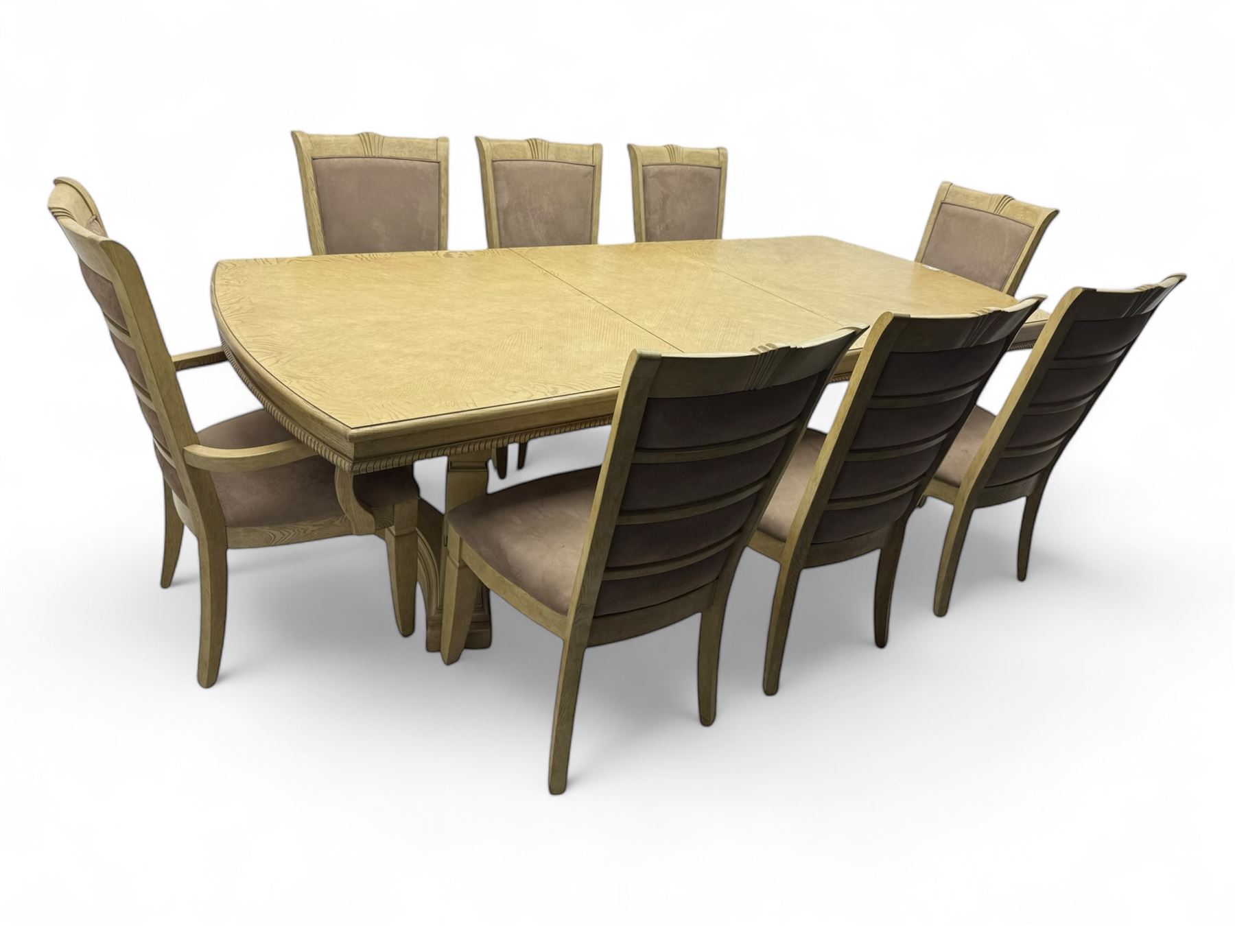 Brunswick - washed oak finish extending dining table, rectangular top with curved ends and carved frieze, central extension leaf, raised on twin pedestals with arched plinth bases and square-sectioned column supports; set of eight (6+2) high-back dining chairs upholstered in beige velvet fabric