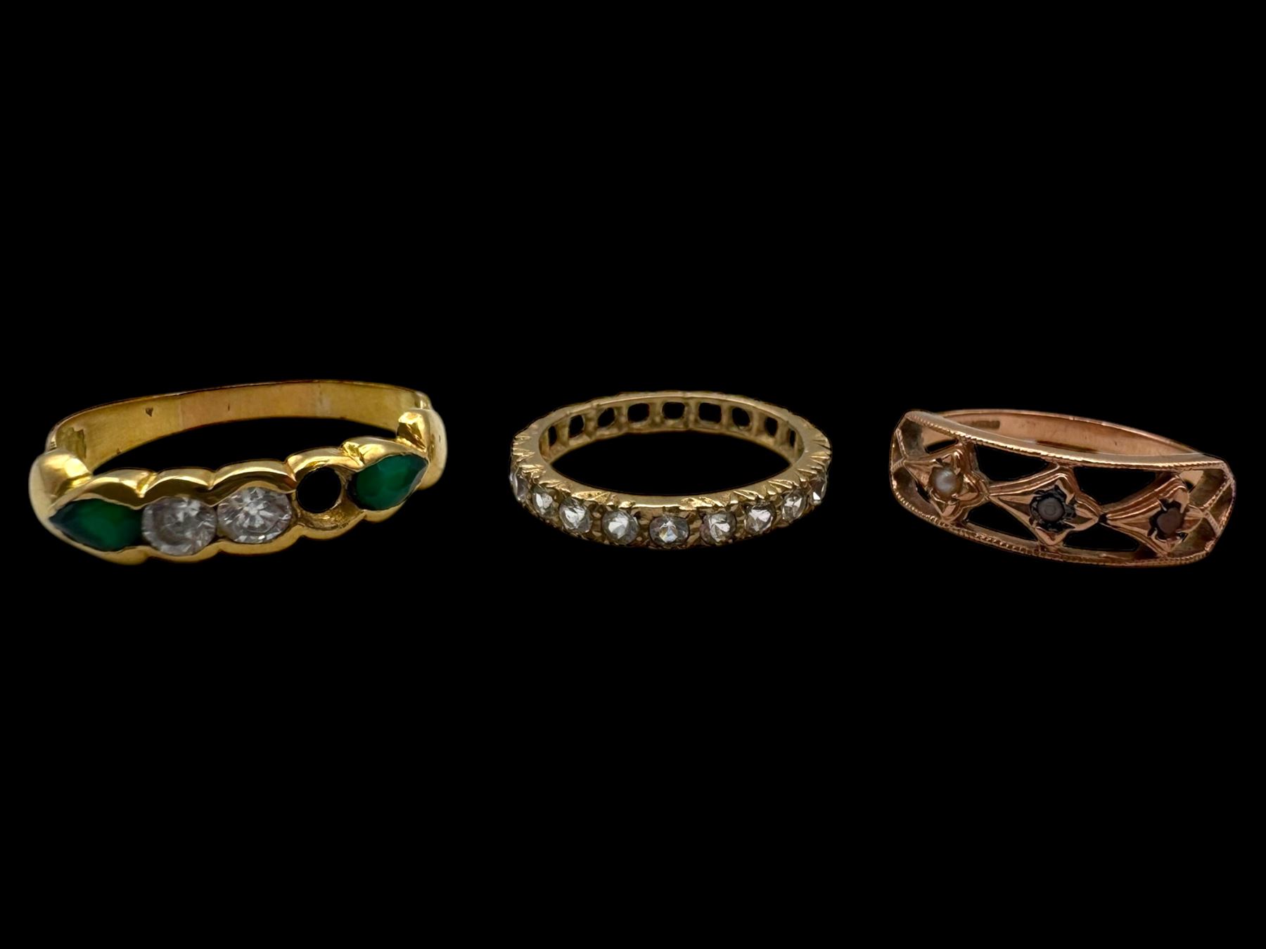 18ct gold stone set ring, 9ct rose gold ring and a 9ct paste set eternity ring