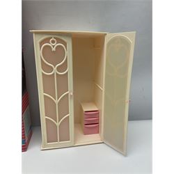 Sindy - furniture and accessories comprising dining suite with separate dresser; two beds; Garden Set; Music Centre; all  boxed; three-piece bedroom suite; settee; Hostess Trolley; two coffee tables; and four-piece bathroom suite including shower cubicle