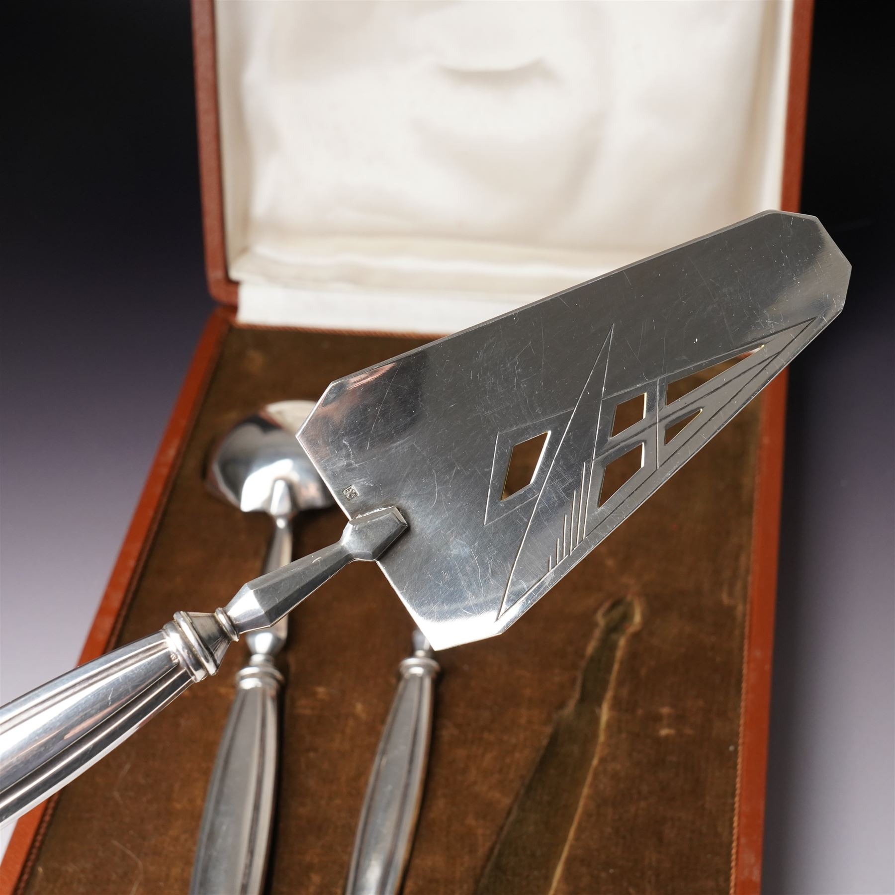 Scandinavian white metal three piece serving set comprising pastry slice, sauce ladle and sifting spoon with fluted handles, cased