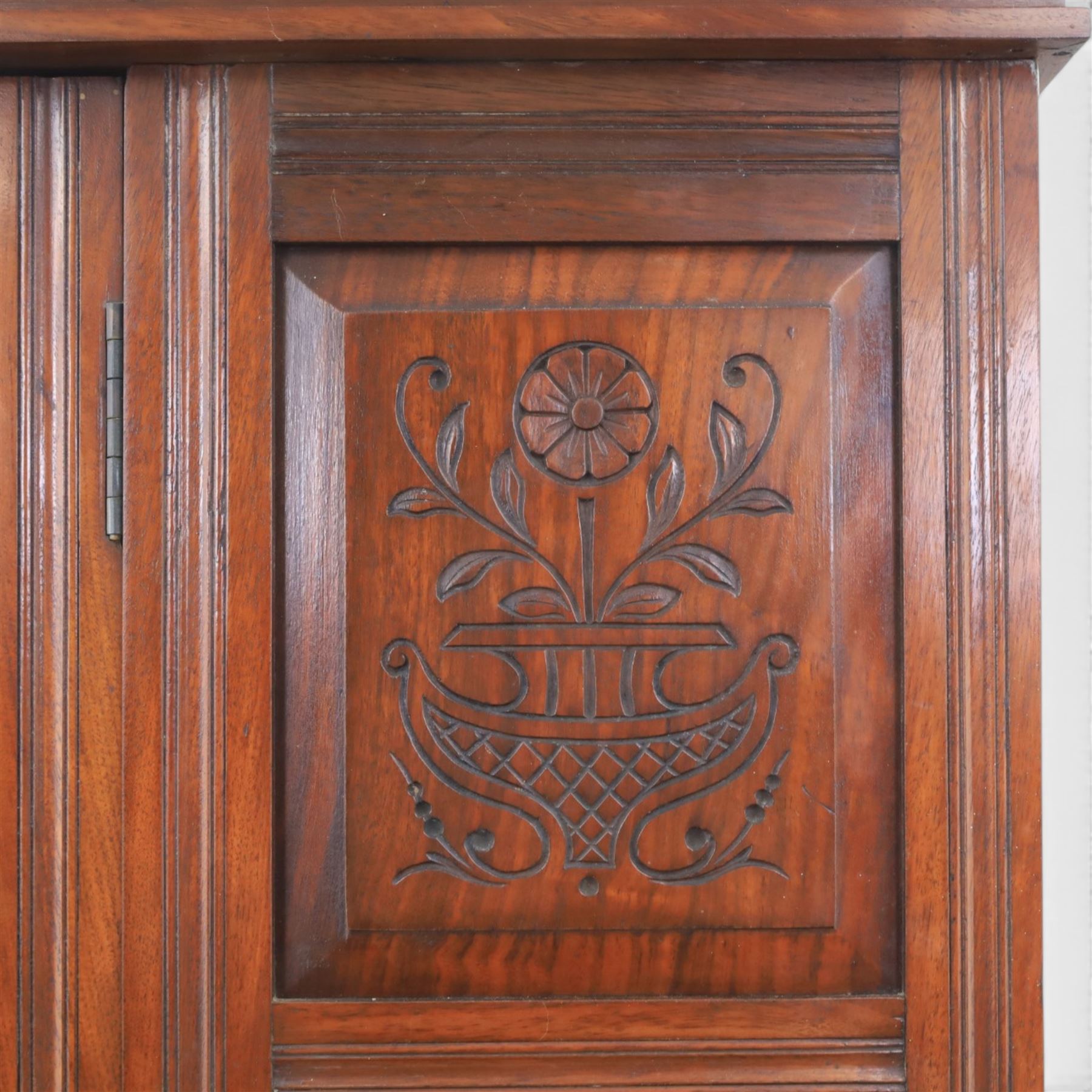 Edwardian walnut wardrobe, featuring single sectional mirror door with bevelled panes, single drawer to base