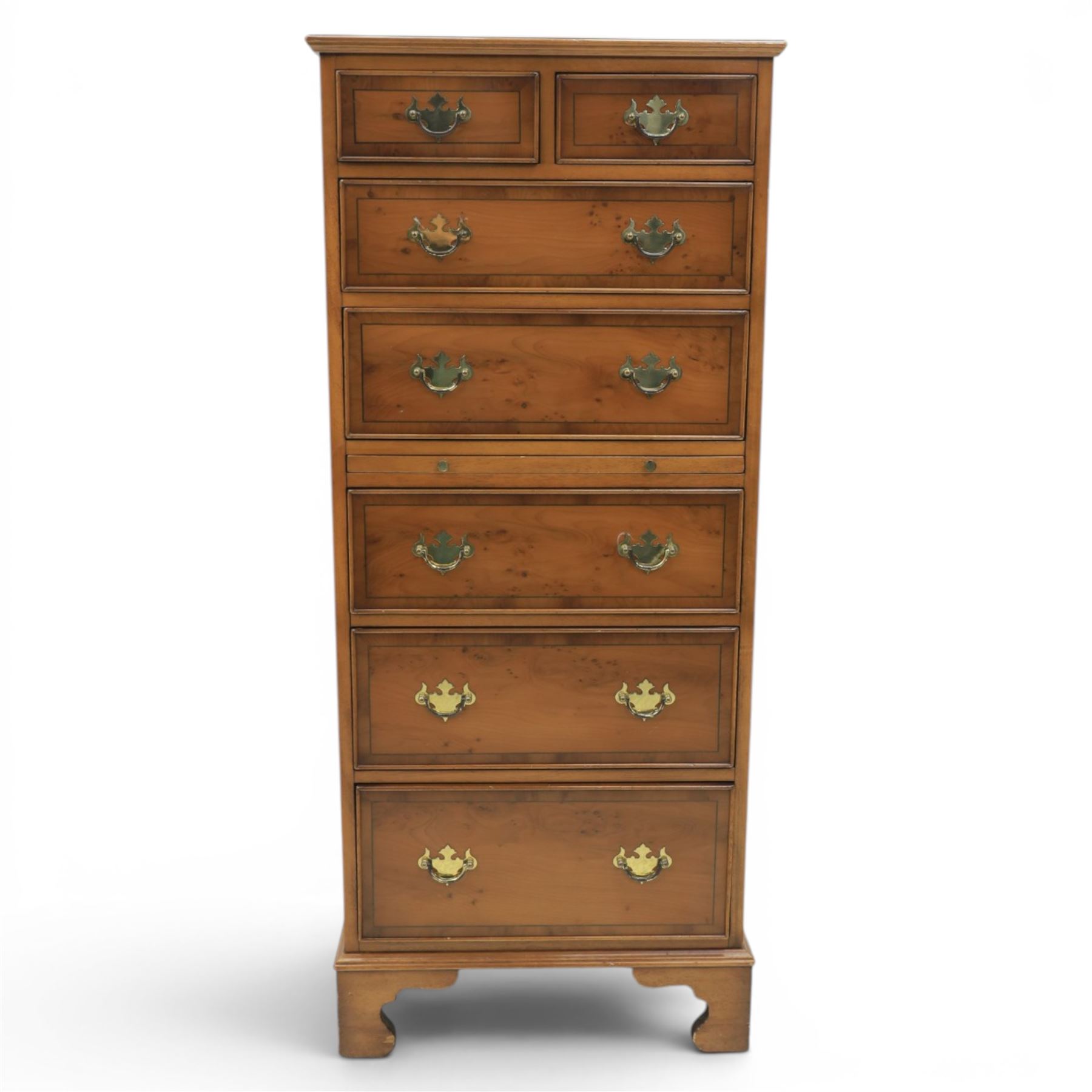 Georgian design yew wood pedestal chest, fitted with seven drawers and slide, brass drop handles