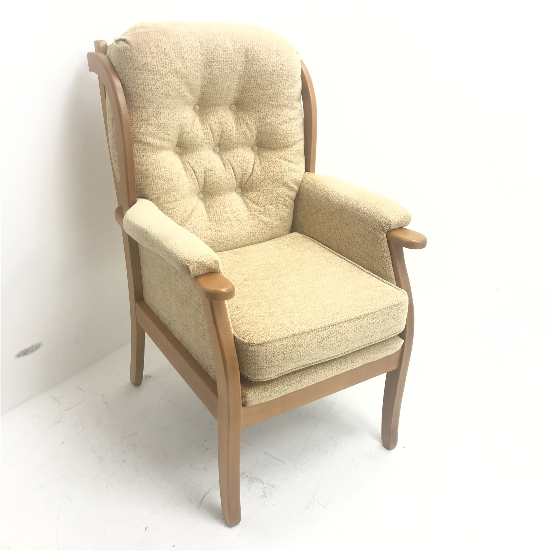 Beevers beech framed high seat armchair, upholstered in a seep buttoned beige fabric, W68cm