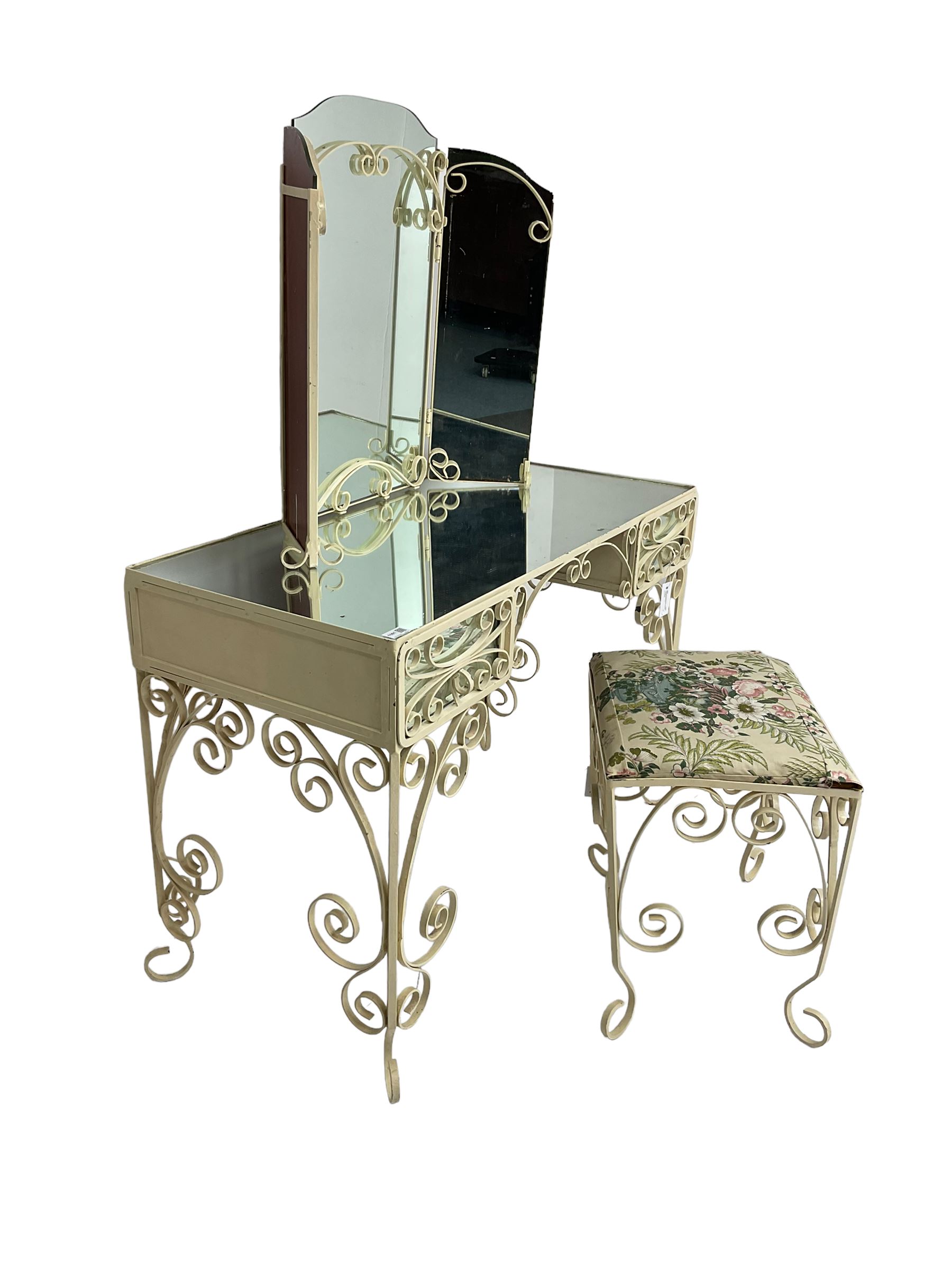 Cream painted scroll work wrought metal dressing table, fitted with two drawers and mirror top, together with matching triple mirror and stool
