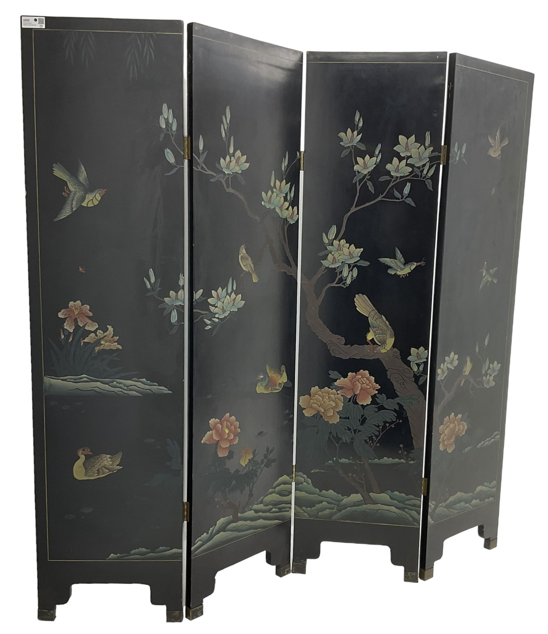 Chinese four-panel folding room screen, black lacquered with a naturalistic scene decorated with trees, birds and flowers