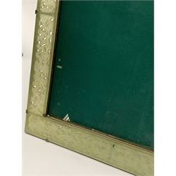 Early 20th century Chinese jade mounted photograph frame, of rectangular form the pierced jade frame carved with flowers and birds, the top panel carved with Foo dogs flaking an applied carved lavender coloured boss, with easel support verso, H33cm
