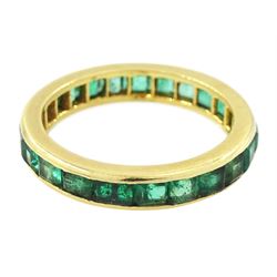 18ct gold emerald full eternity ring, channel set with calibre cut emeralds