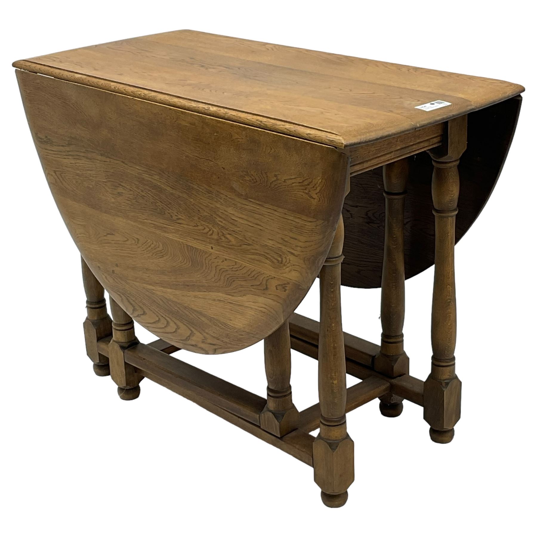 Mid-to-late 20th century oak and beech drop-leaf dining table, gate-leg action base with turned supports