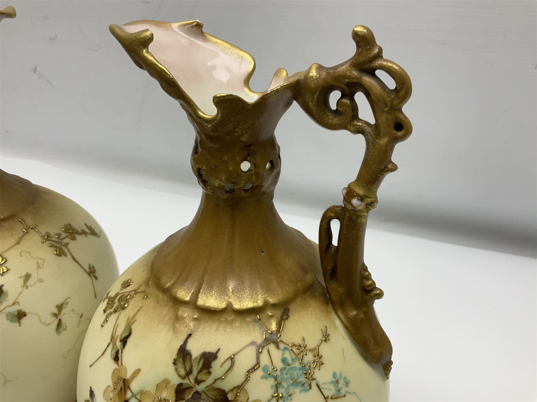 Pair of Turn Vienna blush ivory ewers decorated with floral sprays and gilt, H25cm