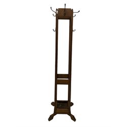 Early to mid-20th century Art Deco design free-standing hallstand, fitted with hooks and metal drip tray, on splayed and stepped feet