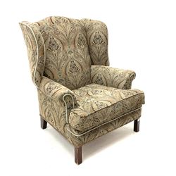 Georgian style wing back sprung armchair, upholstered in stylised patterned fabric, square supports 