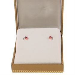 Pair of 9ct gold ruby stud earrings, boxed