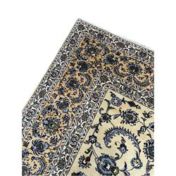 Persian Nain pale sage ground carpet, decorated with curled leaf motifs and palmettes, the busy borders decorated densely with similar design, within floral pattern guard stripes 