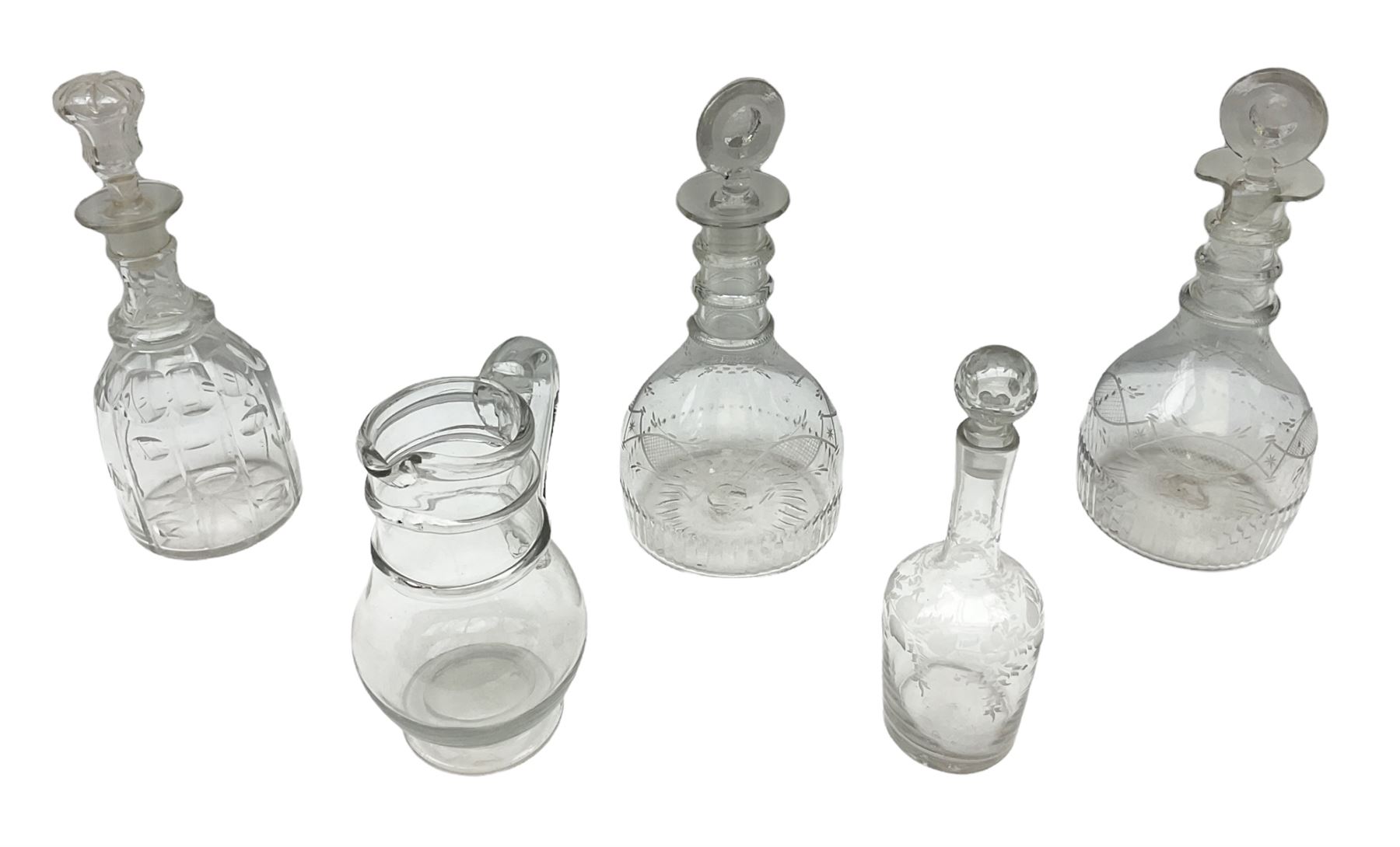 19th century clear glass jug with double ring neck and swan neck handle, together with four 19th century clear glass decanters to include etched examples with triple ring necks, cut examples etc