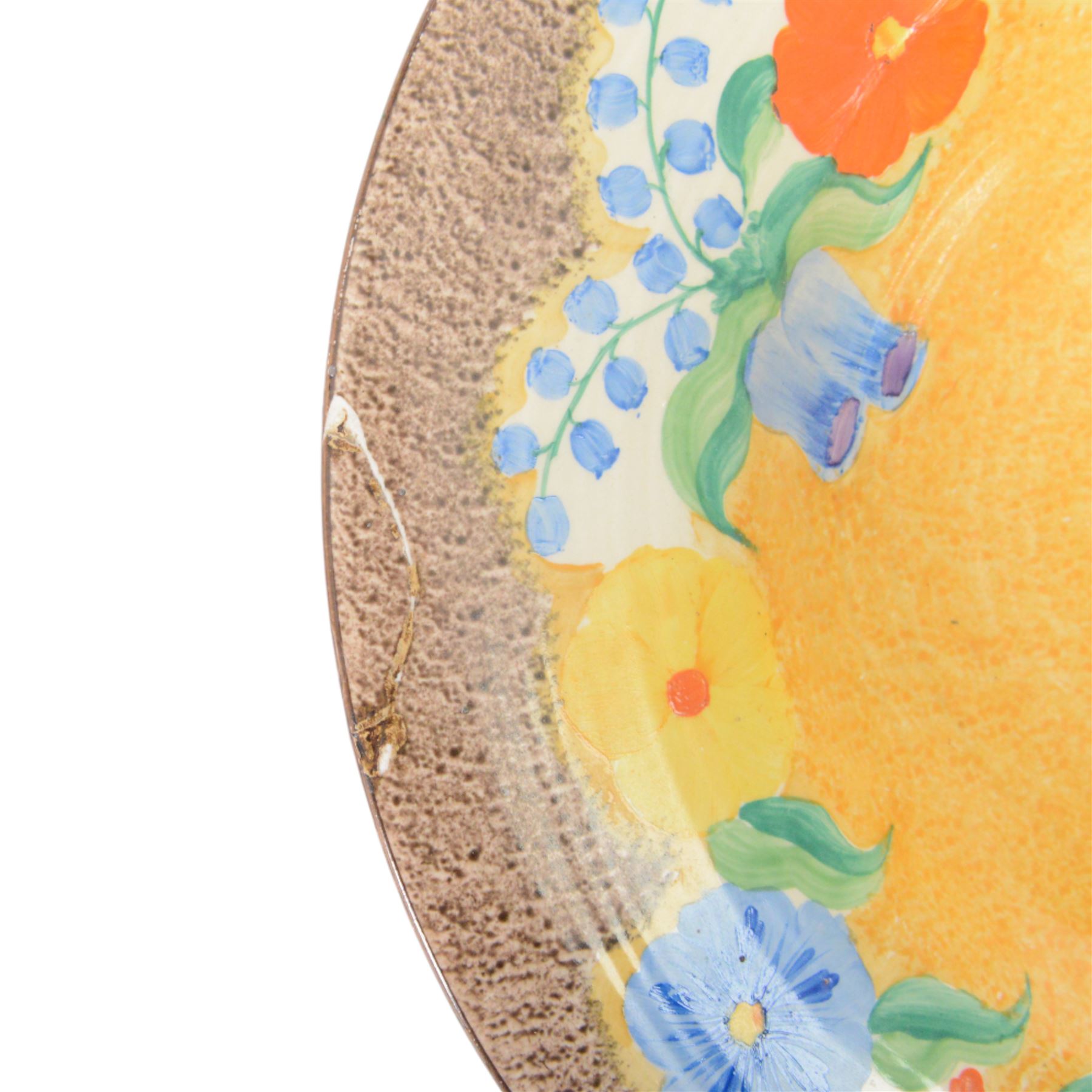 Clarice Cliff Bizarre for Newport Pottery dish, decorated in the Canterbury Bells pattern, with stylised flowers in blue, yellow and orange amongst foliage upon a brown and yellow ground, with printed mark beneath, D33cm