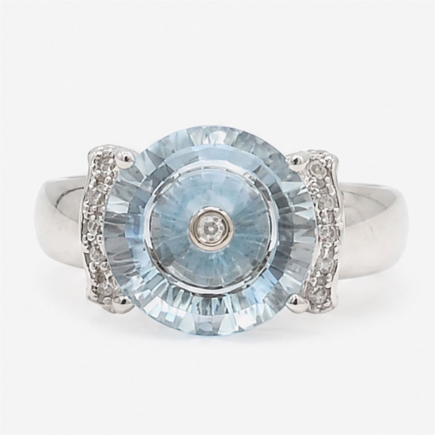 9ct white gold sky blue topaz and diamond Lehrer Torus ring, single round cut topaz of approx 5.20 carat, set with a single round cut diamond, diamond set shoulders and gallery, Birmingham 2012