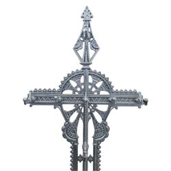 Late 19th century cast iron hall stand in the style of Christopher Dresser, cross shaped upper section with radiating wheel motif and applied hooks, architectural upright with pierced Gothic and geometric detail, fitted with rectangular drip tray and pierced surround, raised on stepped plinth base with bead decoration