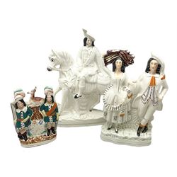 Staffordshire figures comprising one example modelled as a hunter on horseback with a stag draped  across the base of the neck, another as a gentleman and woman and a further clock design figure, all with flat backs (3)