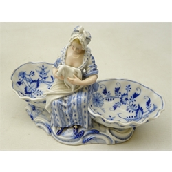  Pair of Dresden blue & white porcelain double salts, seated male and female figures with shell shaped salts on scroll moulded, base, impressed marks with painted crossed swords, W24cm, H17cm (2)   