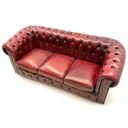 Chesterfield three seat sofa, upholster in deep buttoned ox blood leather