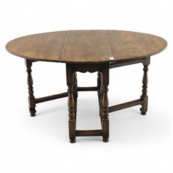 17th century design oak gateleg dining table, oval drop-leaf top on baluster turned supports, twin swinging gate legs united by peripheral stretchers (Extends to 149cm)