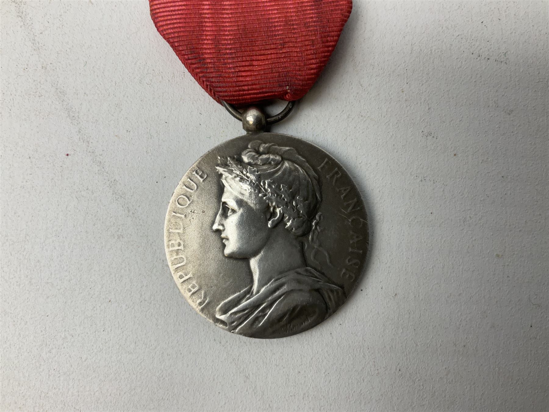 Five continental medals - WW1 Belgian Cross of Fire; WW1 French Croix De Guerre; French Croix De Combattant; French Republic Workers silver merit awarded to L. Mounet 1950; and boxed French Palmes Universitaires Officier d'Academie silver and enamel wreath (5)