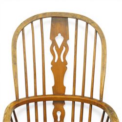 Set of two late 19th century elm and beech Windsor armchairs, each with hoop backs and turned spindles, shaped central splats, solid seats and turned supports united by H-stretchers