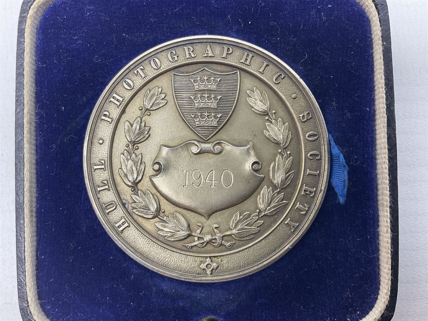 Charles I 1625 hammered silver sixpence, Queen Victoria 1894 crown coin and a cased hallmarked silver medal for the Hull photographic society, engraved '1940' 'Leonard Vokes', all housed in a red Pobjoy Mint coin box