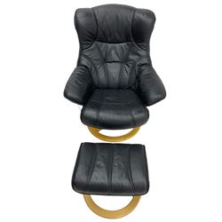 Anderssons of Sweden - mid-20th century design swivel armchair, upholstered black leather, raised on beech U-frame supports with circular base, together with matching footstool 