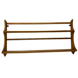 Ercol medium elm two tier wall plate rack, and additional Ercol two tier wall plate rack, with glass shelf and swan detail. 