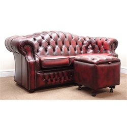  Three seat Chesterfield sofa arched back, upholstered in deep buttoned Burgundy leather, bun feet (W188cm) with similar square storage footstool (W48cm, H48cm, D48cm) (2)  