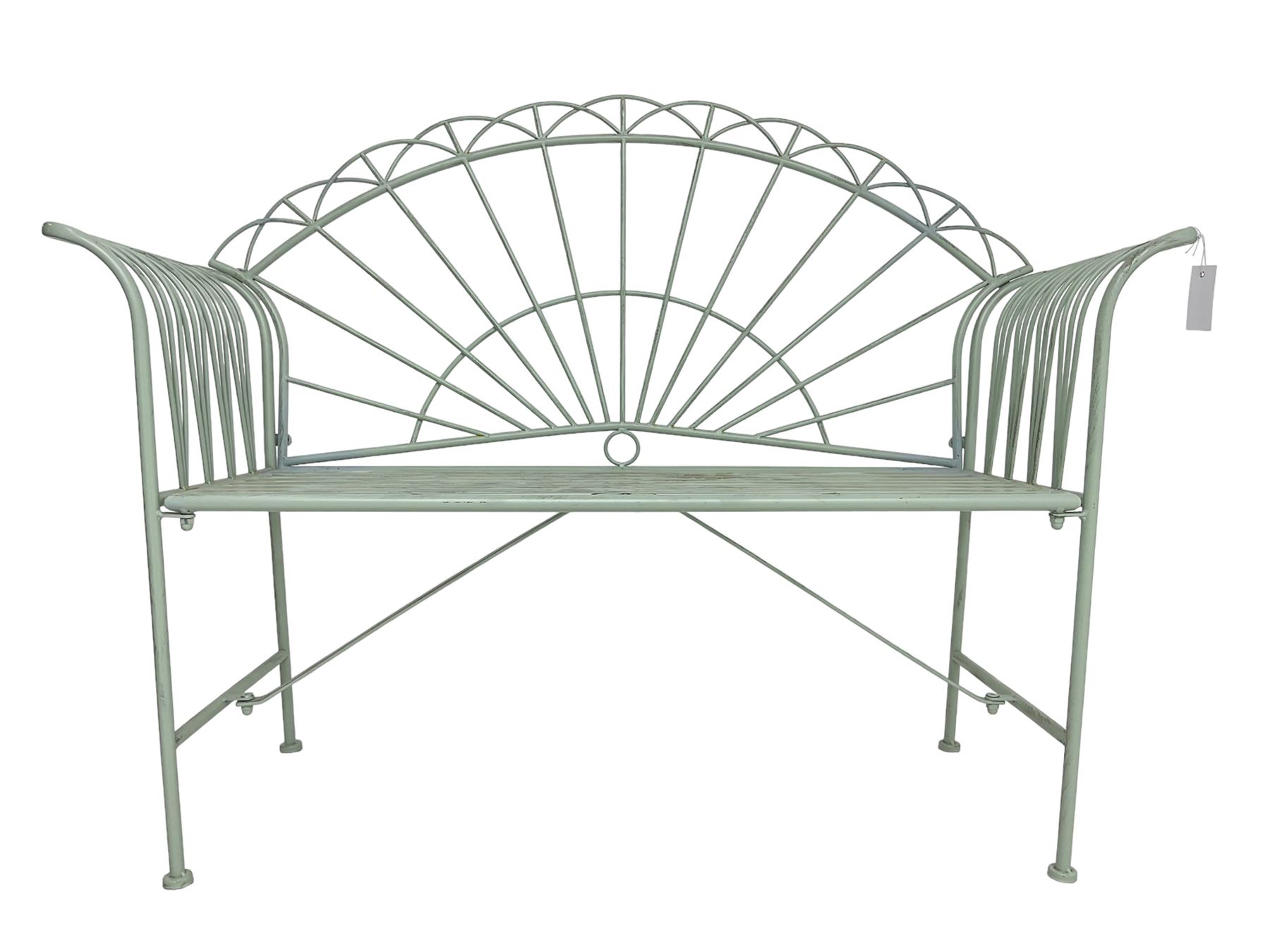 Regency design wrought metal bench, the fan back over out-swept arms, strap seat on supports united by stretchers, in pale teal finish