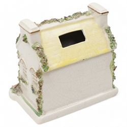 19th century pottery money box in the form of a two storey house with applied floral decoration W14cm  and six pottery cottage pastille burners