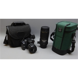  Sony DSLR-A100 Camera with 24-105mm 1:35(22)-4.5 lens and EX Sigma APO Macro 18mm 1:35 lens, with batteries, charger, two memory cards, filters etc in soft carry cases (2)  