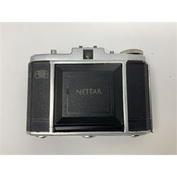 Canon EOS 50e camera body, serial no 8305671 with 'Canon Zoom EF 35-135mm 1:4-5.6' lens together with Halina 35X super camera body, with 'Halina Anastigmat f.c. 1:3.5 f=45mm' lens and other camera equipment 