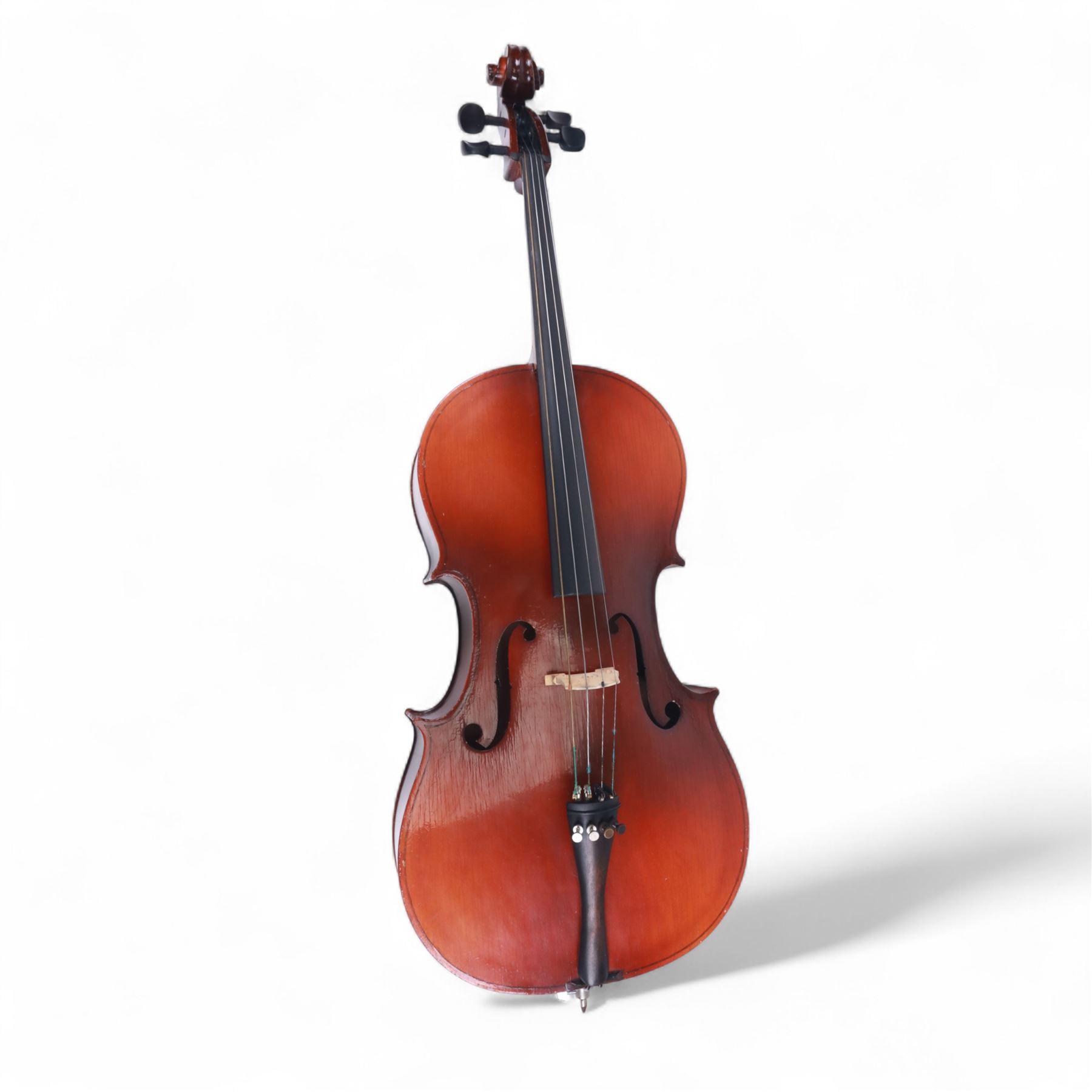 Czechoslovakian 3/4 size cello, with a one piece back, carved scroll neck with ebonised tuning pegs, fingerboard and tail piece, with strings and bridge, no bow. In a soft case.