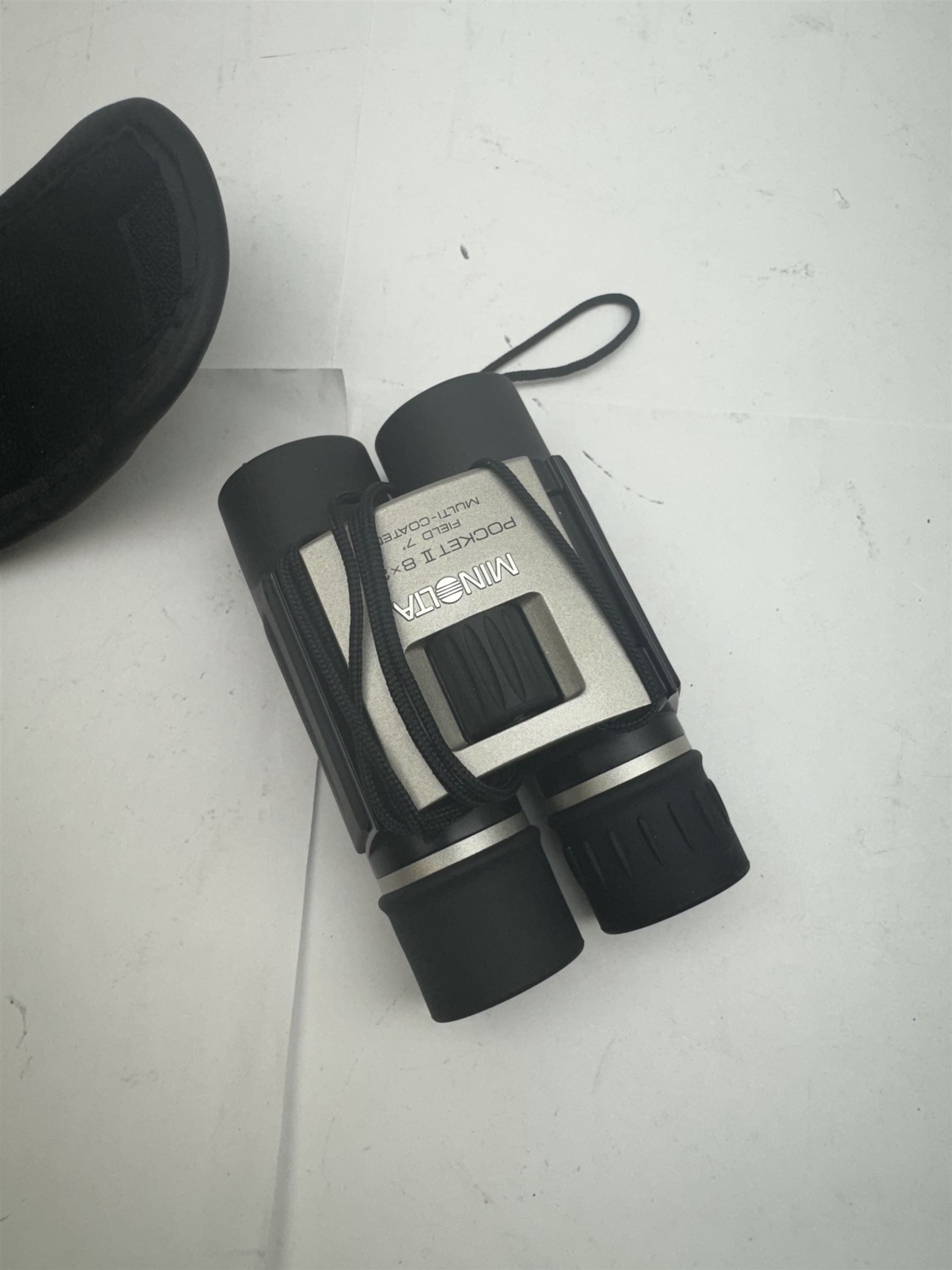 Four pairs of binoculars, to include Carl Zeiss Jena Jenoptem 8x30W serial no. 3750814, Nikon Sporting II 8x40 serial no. 604672, Minolta Pocket II 8x22 Field 7 and Jessops 12x25 Field 4.8 84m/1000m, all in carrying cases 